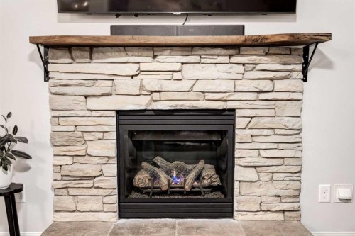 436 Cranberry Circle Se, Calgary, AB - Indoor Photo Showing Living Room With Fireplace