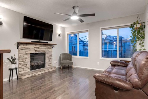 436 Cranberry Circle Se, Calgary, AB - Indoor Photo Showing Living Room With Fireplace