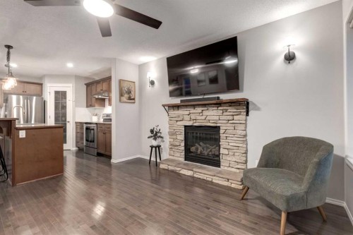 436 Cranberry Circle Se, Calgary, AB - Indoor Photo Showing Other Room With Fireplace