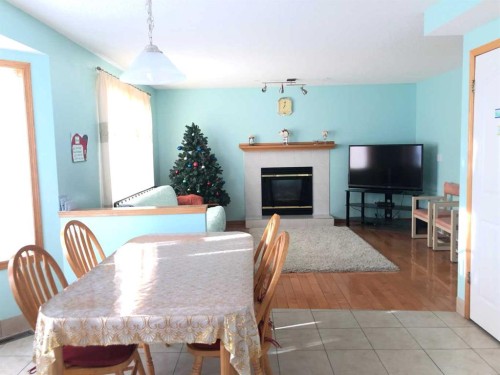 264 Hawkmount Close, Calgary, AB - Indoor Photo Showing Dining Room With Fireplace