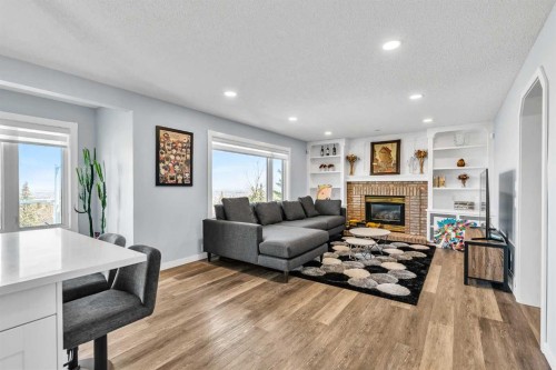 215 Edgevalley Mews, Calgary, AB - Indoor Photo Showing Living Room With Fireplace