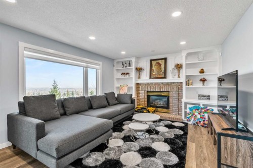 215 Edgevalley Mews, Calgary, AB - Indoor Photo Showing Living Room With Fireplace