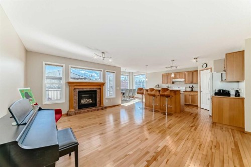 84 Cougarstone Square Sw, Calgary, AB - Indoor With Fireplace