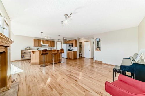 84 Cougarstone Square Sw, Calgary, AB - Indoor Photo Showing Other Room With Fireplace