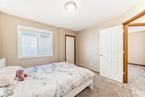 84 Cougarstone Square Sw, Calgary, AB - Indoor Photo Showing Bedroom