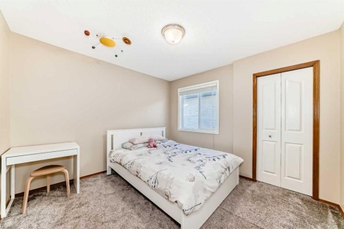84 Cougarstone Square Sw, Calgary, AB - Indoor Photo Showing Bedroom