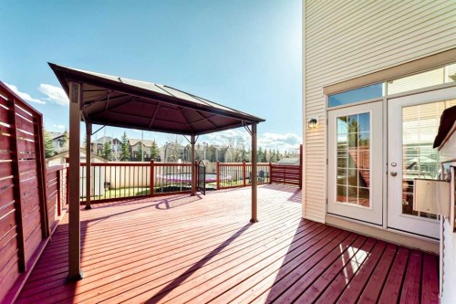 84 Cougarstone Square Sw, Calgary, AB - Outdoor With Deck Patio Veranda With Exterior