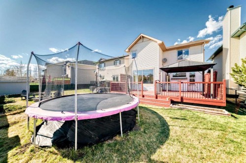 84 Cougarstone Square Sw, Calgary, AB - Outdoor With Deck Patio Veranda