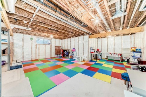 84 Cougarstone Square Sw, Calgary, AB - Indoor Photo Showing Basement