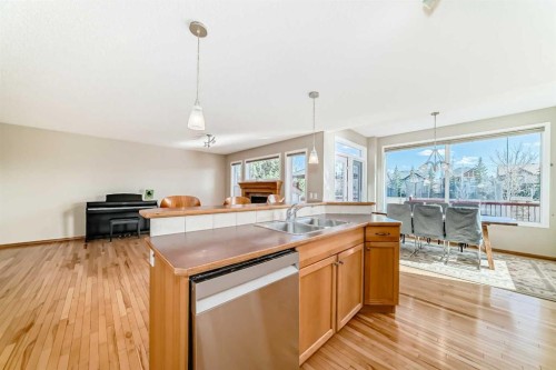 84 Cougarstone Square Sw, Calgary, AB - Indoor Photo Showing Kitchen With Double Sink