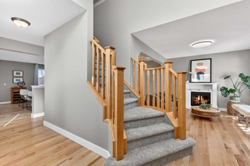 95 Crestmont Drive Sw, Calgary, AB - Indoor Photo Showing Other Room With Fireplace