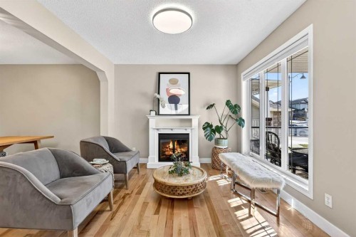 95 Crestmont Drive Sw, Calgary, AB - Indoor Photo Showing Living Room With Fireplace