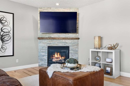 95 Crestmont Drive Sw, Calgary, AB - Indoor With Fireplace