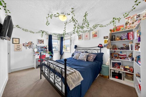 917 Channelside Road Sw, Airdrie, AB - Indoor Photo Showing Bedroom
