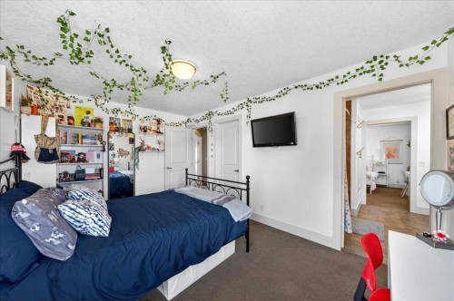 917 Channelside Road Sw, Airdrie, AB - Indoor Photo Showing Bedroom