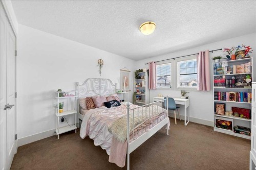 917 Channelside Road Sw, Airdrie, AB - Indoor Photo Showing Bedroom
