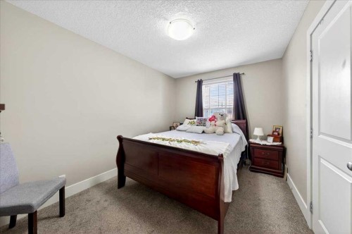 917 Channelside Road Sw, Airdrie, AB - Indoor Photo Showing Bedroom