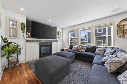 917 Channelside Road Sw, Airdrie, AB - Indoor Photo Showing Living Room With Fireplace