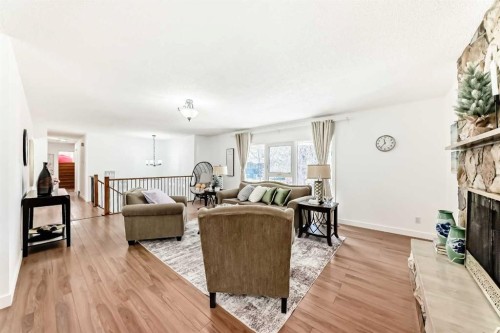 451 Huntbourne Hill Ne, Calgary, AB - Indoor Photo Showing Living Room With Fireplace