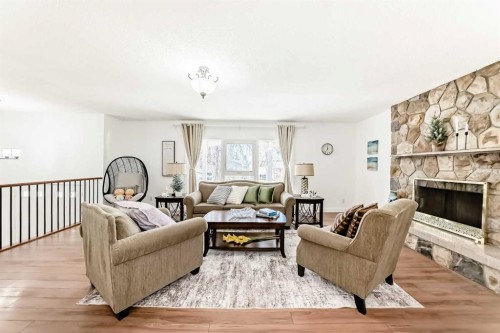 451 Huntbourne Hill Ne, Calgary, AB - Indoor Photo Showing Living Room With Fireplace
