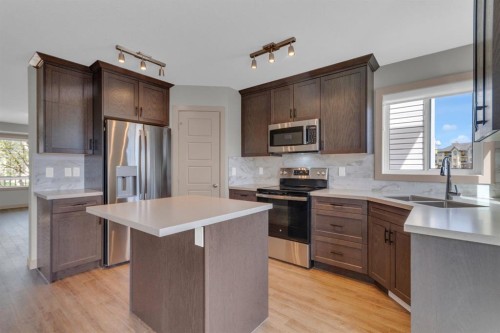 19 Bridleglen Road Sw, Calgary, AB - Indoor Photo Showing Kitchen With Stainless Steel Kitchen With Double Sink