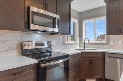 19 Bridleglen Road Sw, Calgary, AB - Indoor Photo Showing Kitchen With Stainless Steel Kitchen With Double Sink