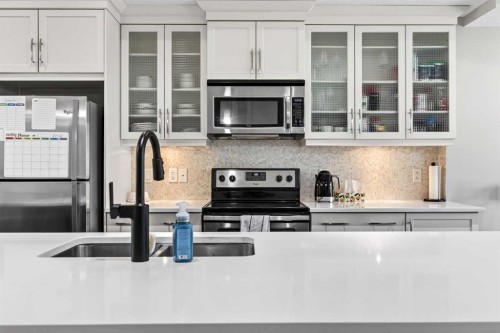 548 Quarry Park Boulevard Se, Calgary, AB - Indoor Photo Showing Kitchen With Double Sink With Upgraded Kitchen