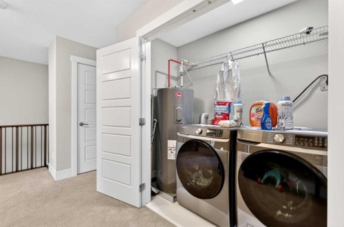 548 Quarry Park Boulevard Se, Calgary, AB - Indoor Photo Showing Laundry Room