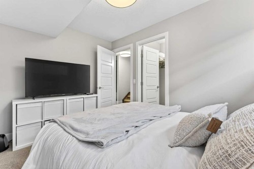 548 Quarry Park Boulevard Se, Calgary, AB - Indoor Photo Showing Bedroom