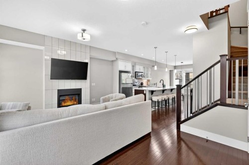 548 Quarry Park Boulevard Se, Calgary, AB - Indoor Photo Showing Living Room With Fireplace