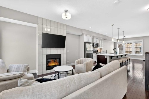 548 Quarry Park Boulevard Se, Calgary, AB - Indoor Photo Showing Living Room With Fireplace