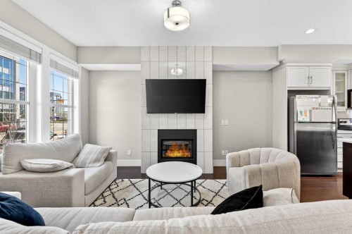 548 Quarry Park Boulevard Se, Calgary, AB - Indoor Photo Showing Living Room With Fireplace