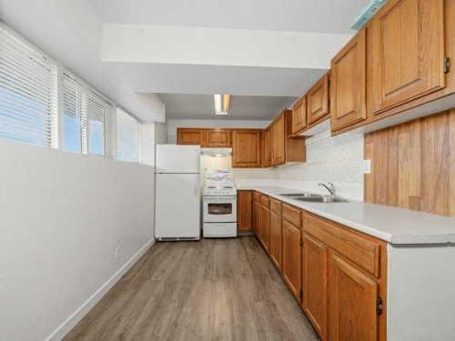 11759 Canfield Road Sw, Calgary, AB - Indoor Photo Showing Kitchen With Double Sink