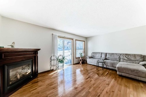 209 Somervale Point Sw, Calgary, AB - Indoor Photo Showing Living Room With Fireplace