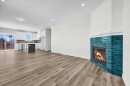 2016 30 Avenue, Nanton, AB  - Indoor Photo Showing Living Room With Fireplace 