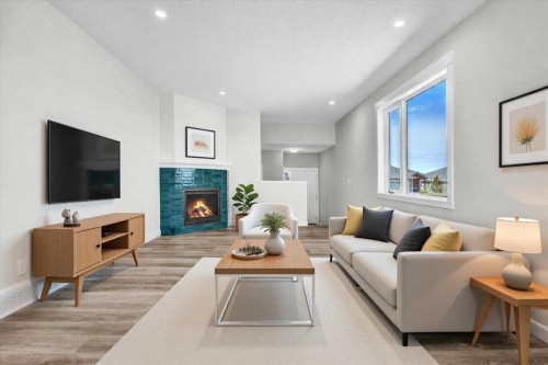 2016 30 Avenue, Nanton, AB - Indoor Photo Showing Living Room With Fireplace