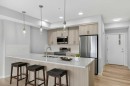 1206-33 Carringham Gate Nw, Calgary, AB  - Indoor Photo Showing Kitchen With Stainless Steel Kitchen With Double Sink With Upgraded Kitchen 