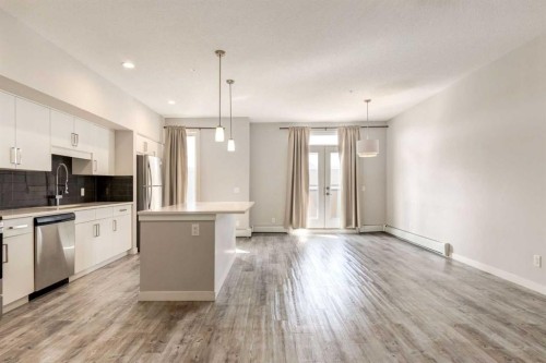 207-10 Westpark Link, Calgary, AB - Indoor Photo Showing Kitchen With Stainless Steel Kitchen