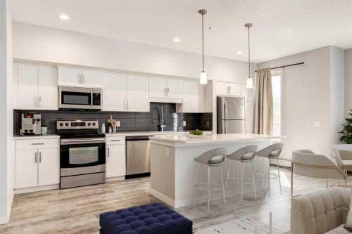 207-10 Westpark Link, Calgary, AB - Indoor Photo Showing Kitchen With Stainless Steel Kitchen With Upgraded Kitchen