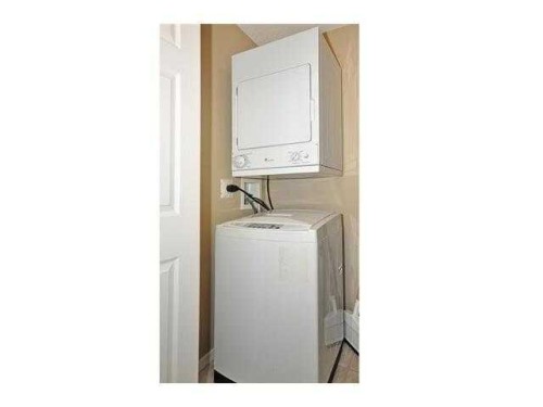 2310-10 Prestwick Bay Se, Calgary, AB - Indoor Photo Showing Laundry Room