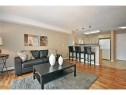 2310-10 Prestwick Bay Se, Calgary, AB  - Indoor Photo Showing Living Room 