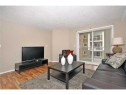 2310-10 Prestwick Bay Se, Calgary, AB  - Indoor Photo Showing Living Room 