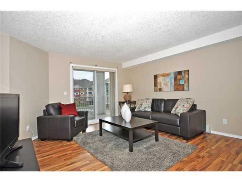 2310-10 Prestwick Bay Se, Calgary, AB - Indoor Photo Showing Living Room