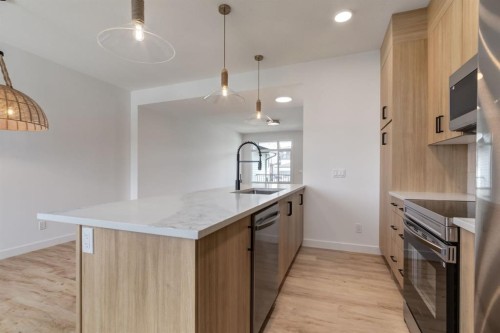 235 Sora Boulevard Se, Calgary, AB - Indoor Photo Showing Kitchen With Upgraded Kitchen