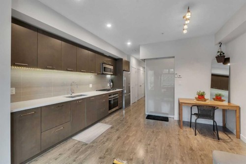 220-323 20 Avenue Sw, Calgary, AB - Indoor Photo Showing Kitchen With Double Sink