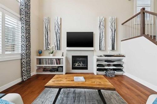 36 Ridge View Close, Cochrane, AB - Indoor Photo Showing Living Room With Fireplace