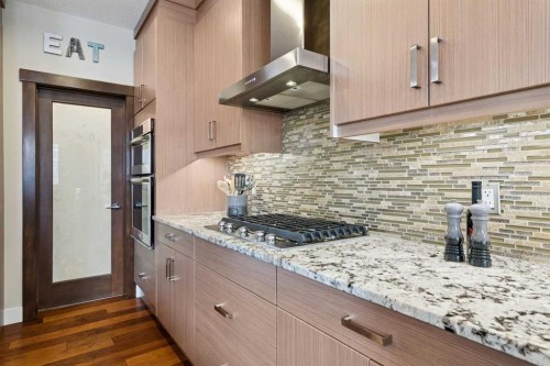 36 Ridge View Close, Cochrane, AB - Indoor Photo Showing Kitchen With Upgraded Kitchen