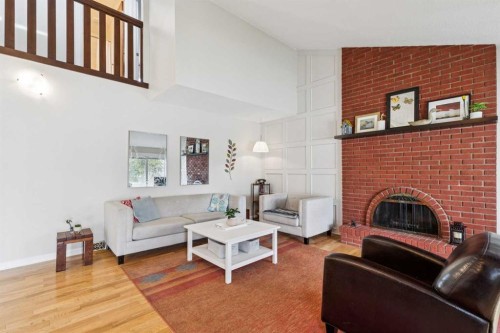 1848 38 Street Ne, Calgary, AB - Indoor Photo Showing Living Room With Fireplace