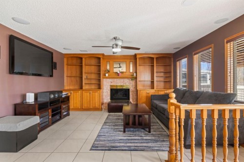87 Applefield Close Se, Calgary, AB - Indoor Photo Showing Other Room With Fireplace