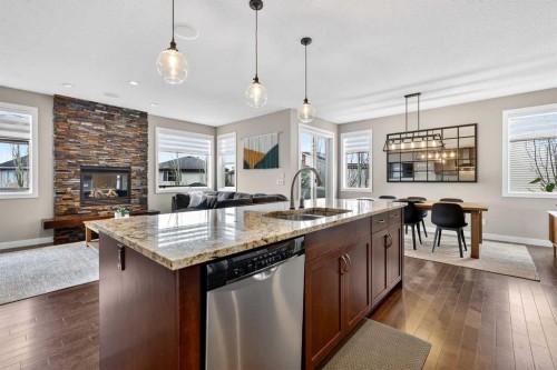 28 Walden View Se, Calgary, AB - Indoor Photo Showing Kitchen With Fireplace With Double Sink With Upgraded Kitchen
